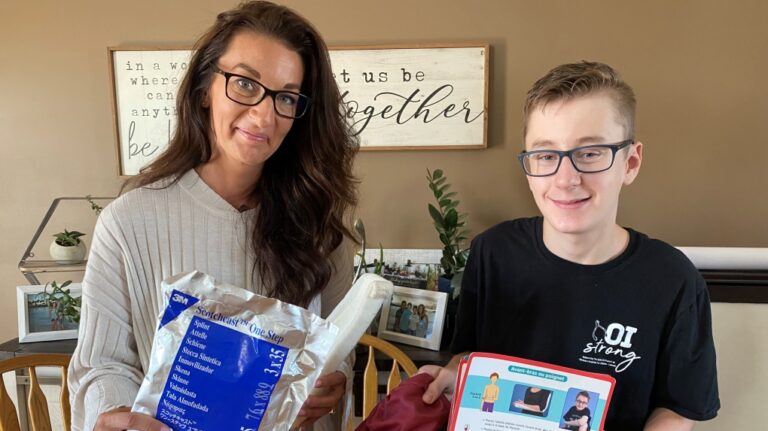 OI Splint Kit being held up by Carter Brown and his mother .